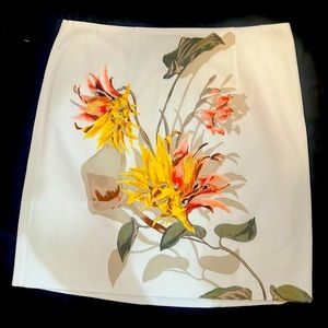 Skirt. 17” long. White House Black Market. Never worn. Embroidery on flowers.